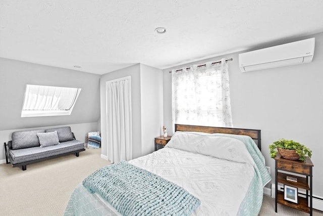 carpeted bedroom with a wall mounted AC, a baseboard heating unit, and baseboards