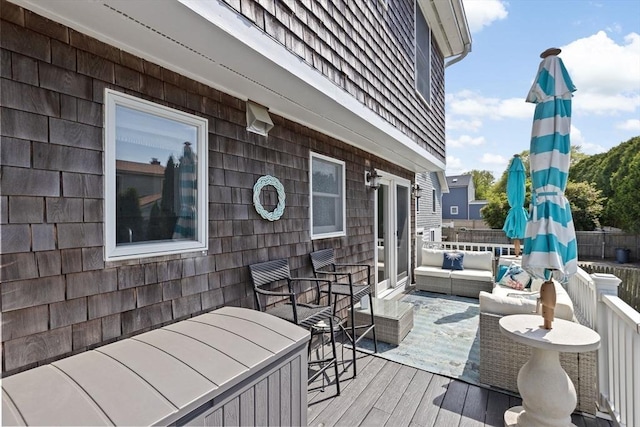 wooden deck with an outdoor hangout area