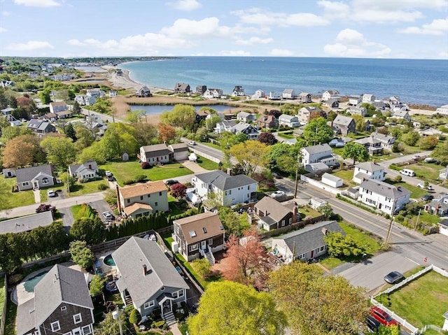 aerial view of residential area featuring a large body of water