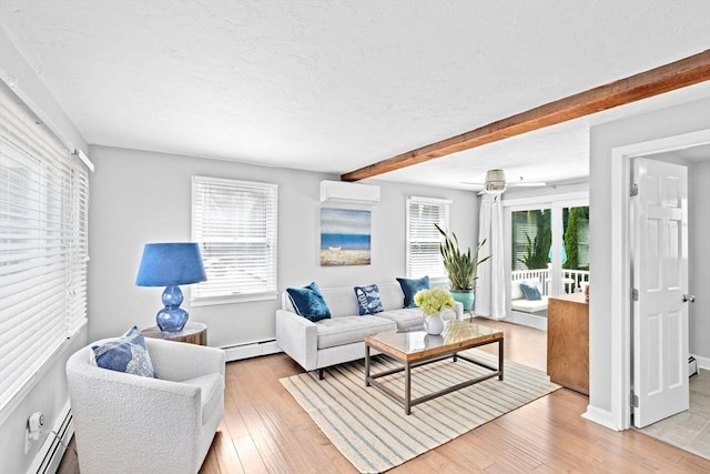 living area with a baseboard heating unit, a wall mounted AC, beamed ceiling, light wood-style floors, and a textured ceiling