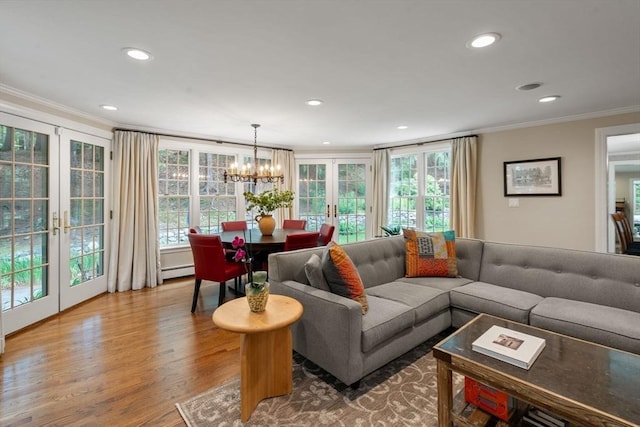 117 Deer Path Ln, Weston, MA 02493 - living room with ornamental molding, a chandelier, french doors, wood finished floors, and recessed lighting