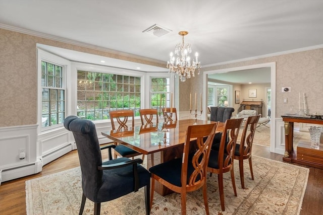 117 Deer Path Ln, Weston, MA 02493 - dining room featuring wallpapered walls, wainscoting, a chandelier, healthy amount of natural light, and crown molding
