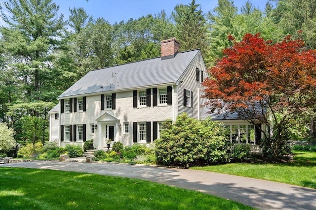 117 Deer Path Ln, Weston, MA 02493 - colonial-style house with a chimney and a front lawn