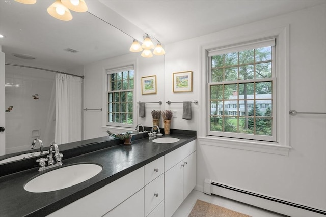 117 Deer Path Ln, Weston, MA 02493 - full bathroom featuring a baseboard radiator, double vanity, and tile patterned flooring