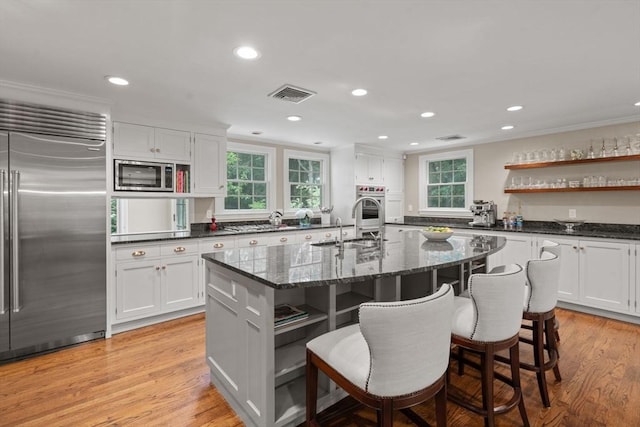 117 Deer Path Ln, Weston, MA 02493 - kitchen featuring built in appliances, open shelves, healthy amount of natural light, recessed lighting, and crown molding