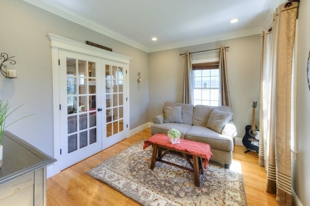 living room featuring light wood-style floors, french doors, recessed lighting, baseboards, and ornamental molding