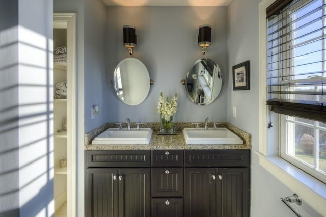 bathroom featuring double vanity and a sink