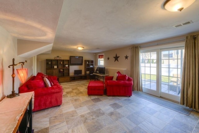 living area featuring visible vents