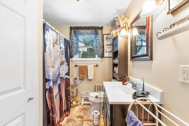 440 Broadway, North Attleboro, MA 02760 - bathroom featuring radiator heating unit, vanity, and tile patterned floors