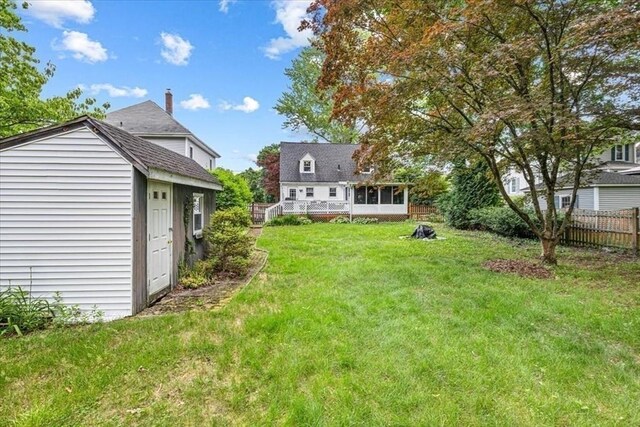 440 Broadway, North Attleboro, MA 02760 - view of yard with an outbuilding, a sunroom, and a deck