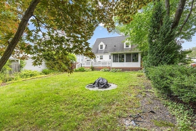 440 Broadway, North Attleboro, MA 02760 - back of property featuring a sunroom, an outdoor fire pit, and a lawn