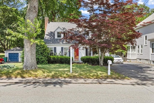 440 Broadway, North Attleboro, MA 02760 - view of front facade with a chimney, a front yard, driveway, and a garage