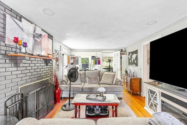 440 Broadway, North Attleboro, MA 02760 - living area featuring a brick fireplace, wood finished floors, and ornamental molding