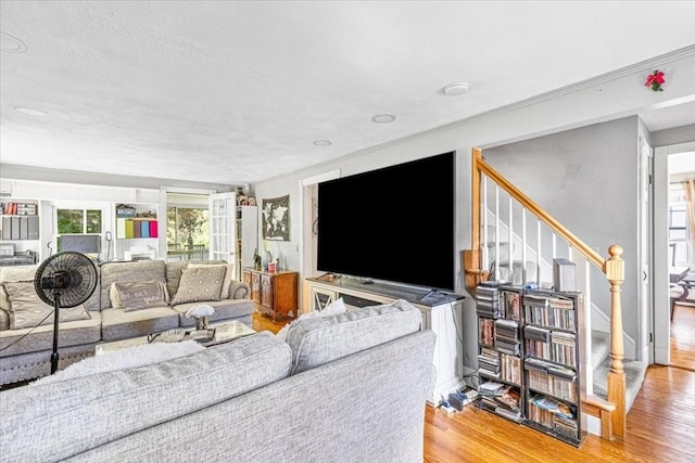 440 Broadway, North Attleboro, MA 02760 - living room with wood finished floors, plenty of natural light, and stairway
