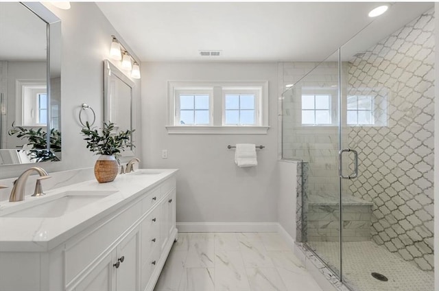 bathroom with vanity and an enclosed shower