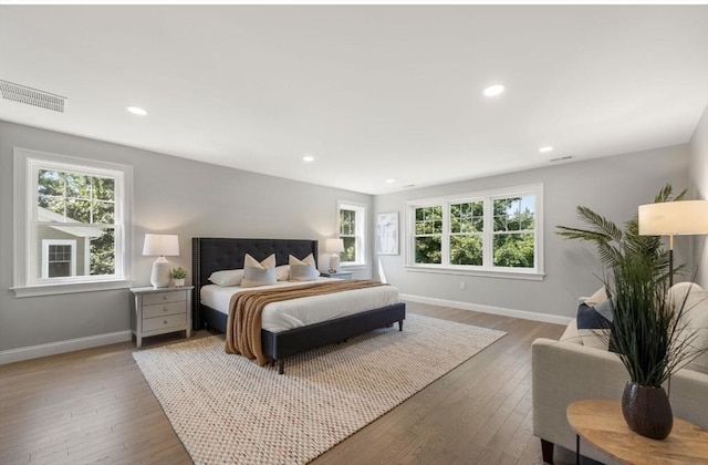 bedroom with hardwood / wood-style flooring