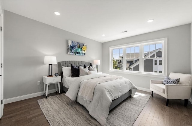 bedroom featuring dark hardwood / wood-style flooring