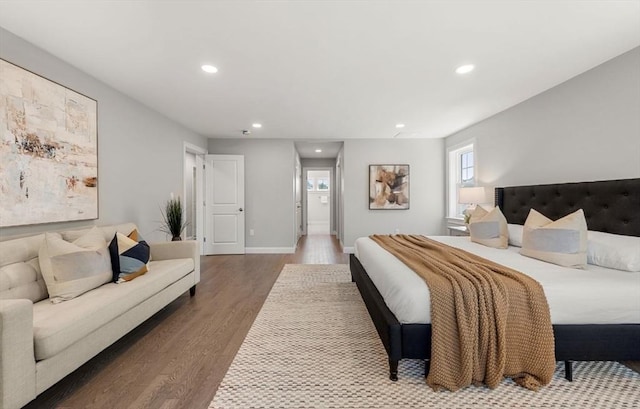 bedroom with hardwood / wood-style floors