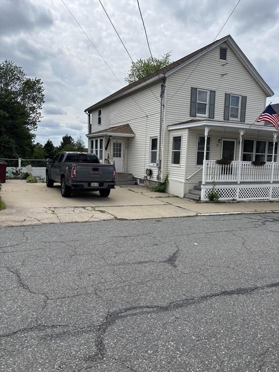 20 Osgood Ave, Lowell, MA 01850 - traditional-style home with covered porch and driveway