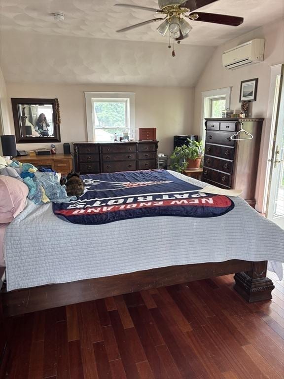 20 Osgood Ave, Lowell, MA 01850 - bedroom with a wall unit AC, wood-type flooring, multiple windows, vaulted ceiling, and ceiling fan