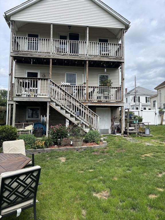 20 Osgood Ave, Lowell, MA 01850 - back of property featuring a balcony and stairs