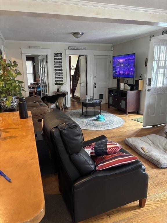 20 Osgood Ave, Lowell, MA 01850 - living room featuring stairway, ornamental molding, and wood finished floors