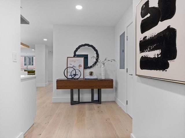 hallway with recessed lighting, baseboards, and wood finished floors