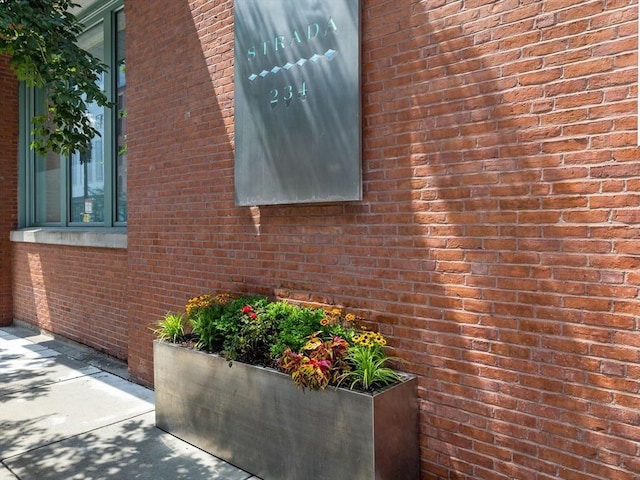 view of property exterior featuring brick siding