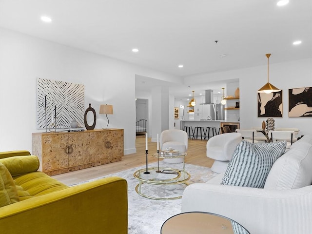 living room with recessed lighting and wood finished floors