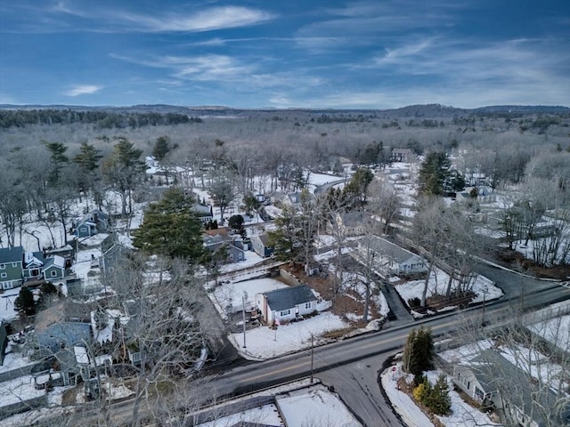 snowy aerial view with a residential view