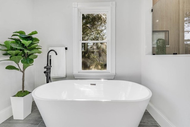 bathroom featuring a tub to relax in