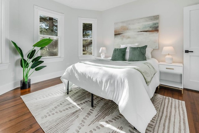 bedroom featuring dark wood-type flooring