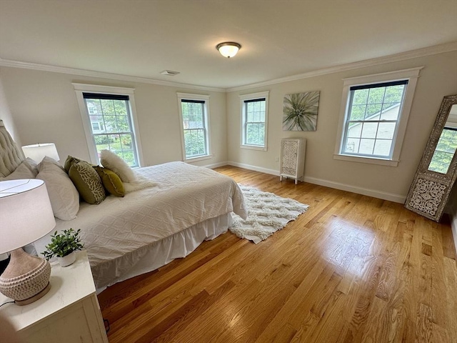 14 Pine Knoll Rd, Lexington, MA 02420 - bedroom featuring multiple windows, crown molding, baseboards, and light wood-style floors
