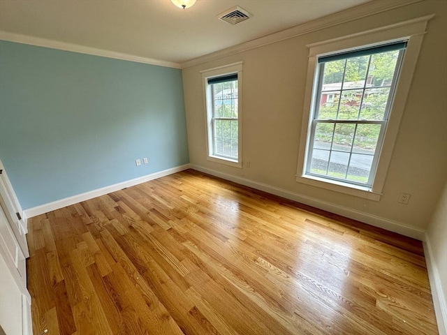14 Pine Knoll Rd, Lexington, MA 02420 - unfurnished room with ornamental molding, healthy amount of natural light, baseboards, and light wood-type flooring