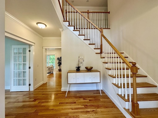 14 Pine Knoll Rd, Lexington, MA 02420 - stairs with ornamental molding, wood finished floors, and baseboards