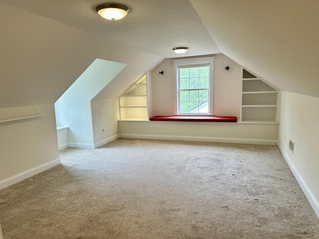 14 Pine Knoll Rd, Lexington, MA 02420 - additional living space featuring carpet, vaulted ceiling, built in features, and baseboards