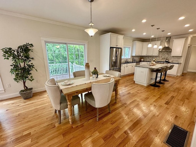 14 Pine Knoll Rd, Lexington, MA 02420 - dining room with ornamental molding, plenty of natural light, light wood-type flooring, recessed lighting, and baseboards