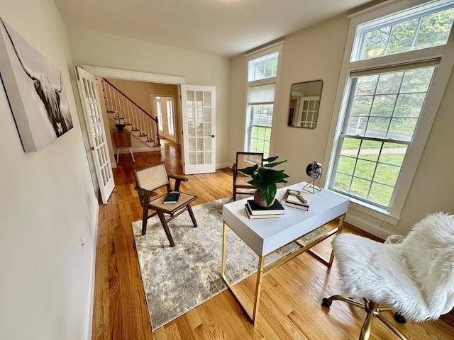 14 Pine Knoll Rd, Lexington, MA 02420 - living area with stairs, light wood-style floors, and baseboards