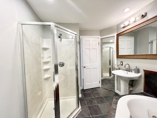 full bath with a stall shower, tile patterned flooring, a sink, and a tub
