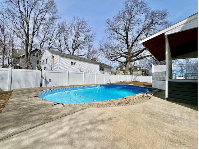 view of pool featuring a fenced backyard, a patio, and a fenced in pool