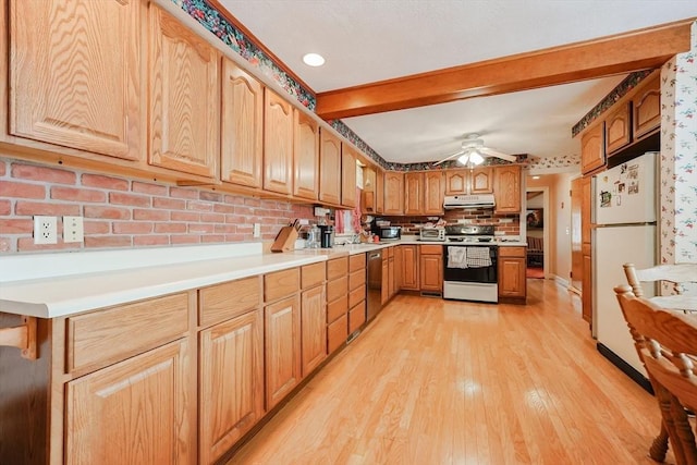 kitchen with light wood-style floors, stainless steel appliances, light countertops, under cabinet range hood, and beam ceiling