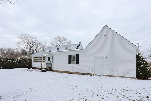 view of snow covered house