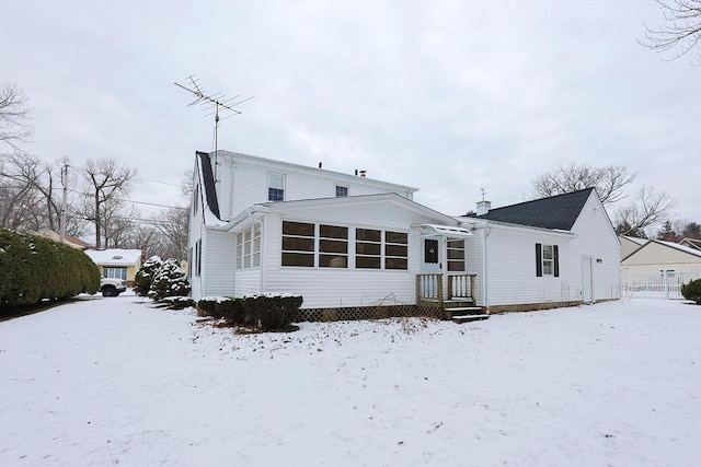 view of snow covered house