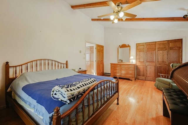 bedroom with light wood finished floors, ceiling fan, a baseboard radiator, vaulted ceiling with beams, and a closet