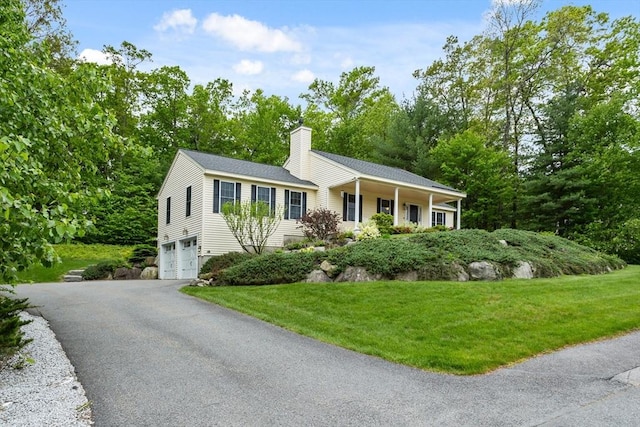 71 Fox Run Dr, Ayer, MA 01432 - ranch-style home with an attached garage, a chimney, a front yard, and driveway
