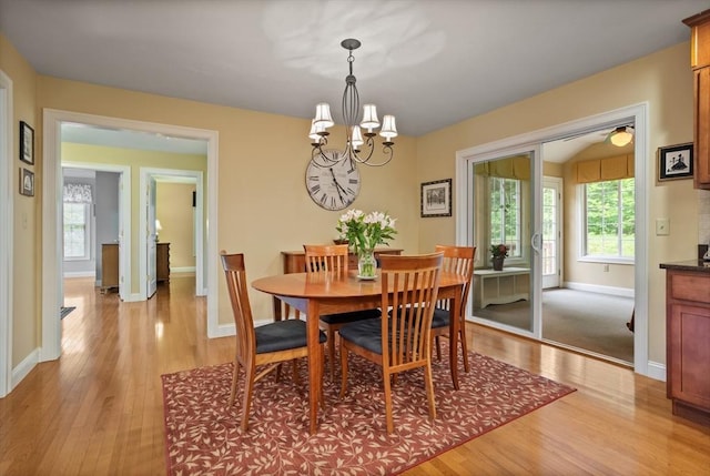 71 Fox Run Dr, Ayer, MA 01432 - dining room with light wood-type flooring, a chandelier, and healthy amount of natural light