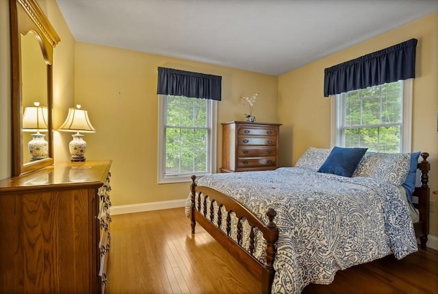 71 Fox Run Dr, Ayer, MA 01432 - bedroom with multiple windows, baseboards, and hardwood / wood-style floors