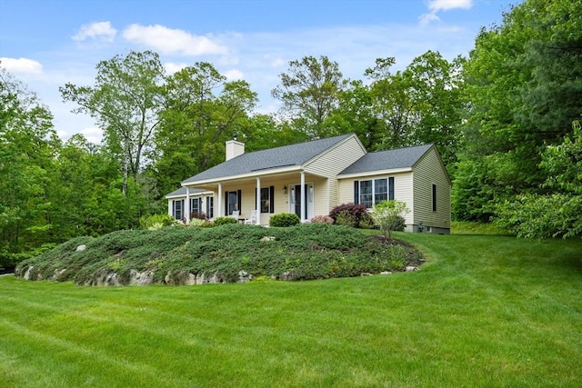 71 Fox Run Dr, Ayer, MA 01432 - view of front facade with a chimney, a front lawn, and roof with shingles