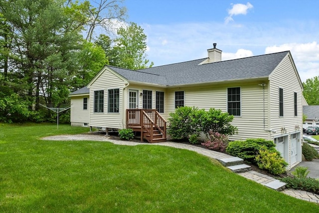 71 Fox Run Dr, Ayer, MA 01432 - back of property featuring a chimney, a shingled roof, a lawn, an attached garage, and driveway