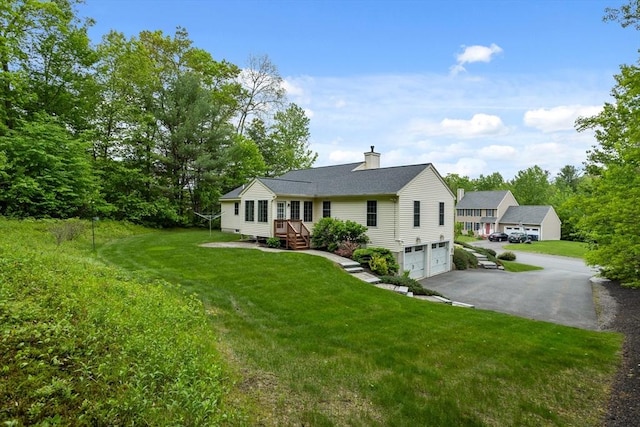 71 Fox Run Dr, Ayer, MA 01432 - ranch-style house featuring an attached garage, driveway, a chimney, and a front yard